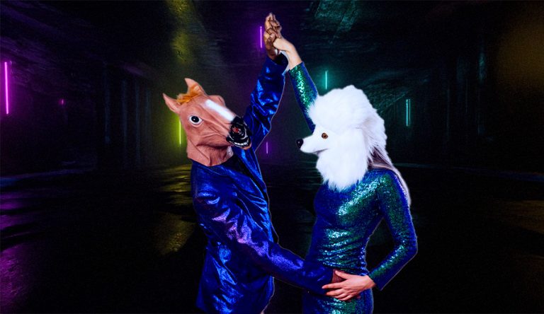 a picture of a man in a horse mask, with a woman in a poodle mask dancing